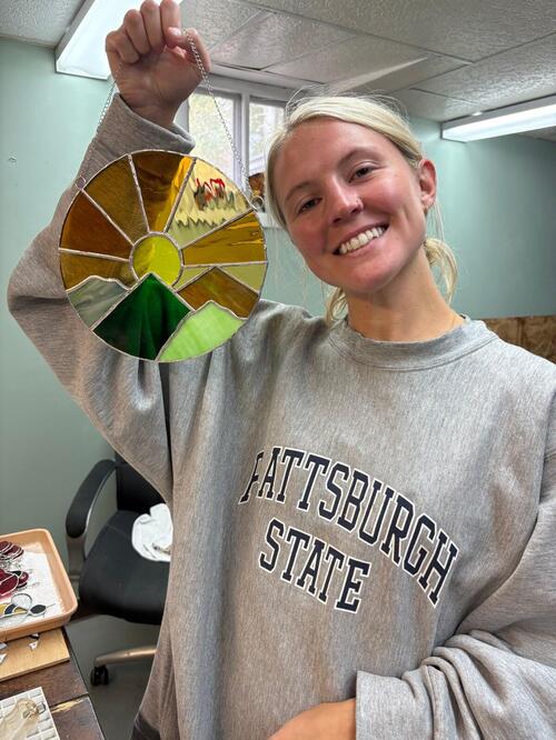 Student completing stained glass class at Pane in the Glass Wyo